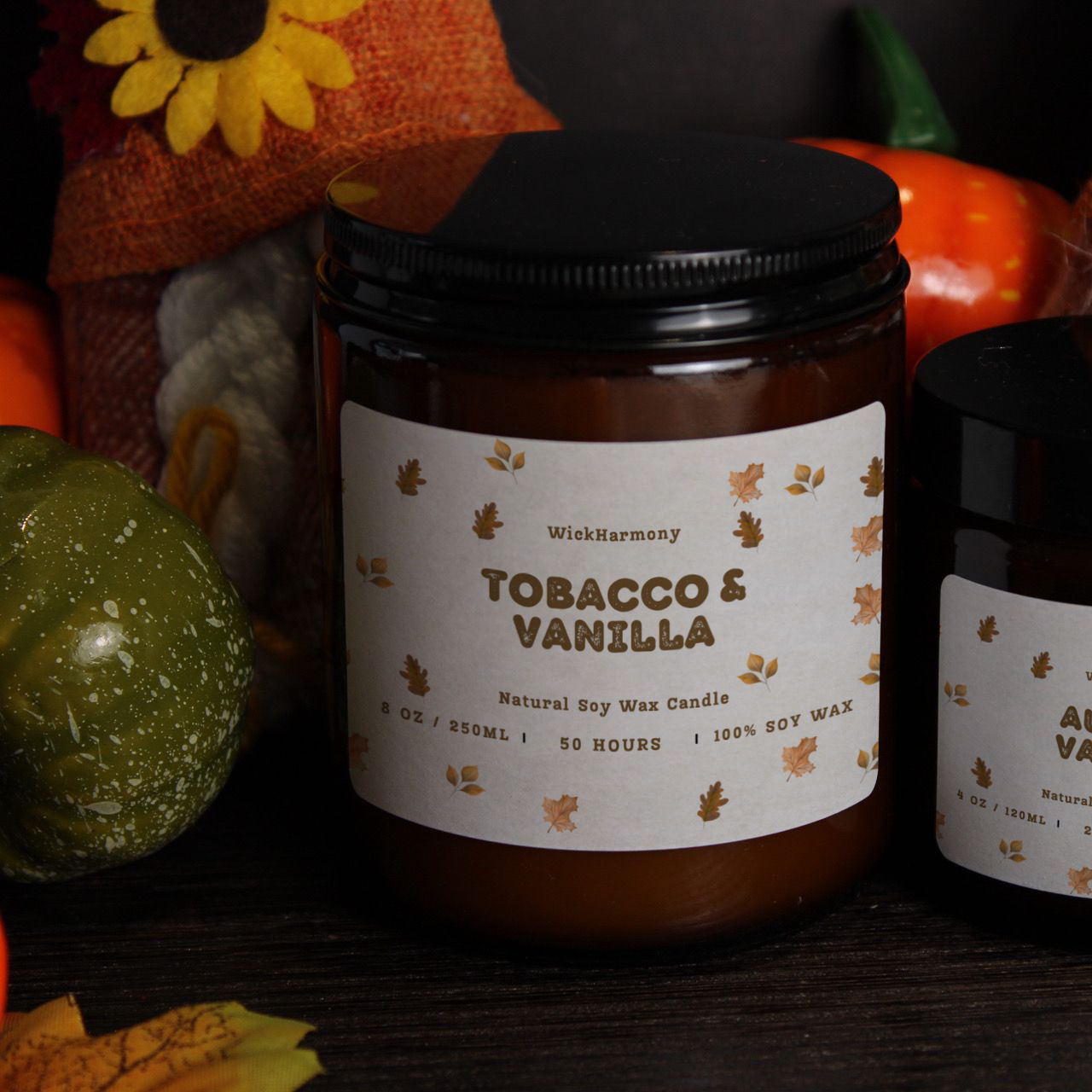 Two WickHarmony soy candles, a 250ml and 120ml jar, showing 'The Autumn Breeze' minimalist leaf design