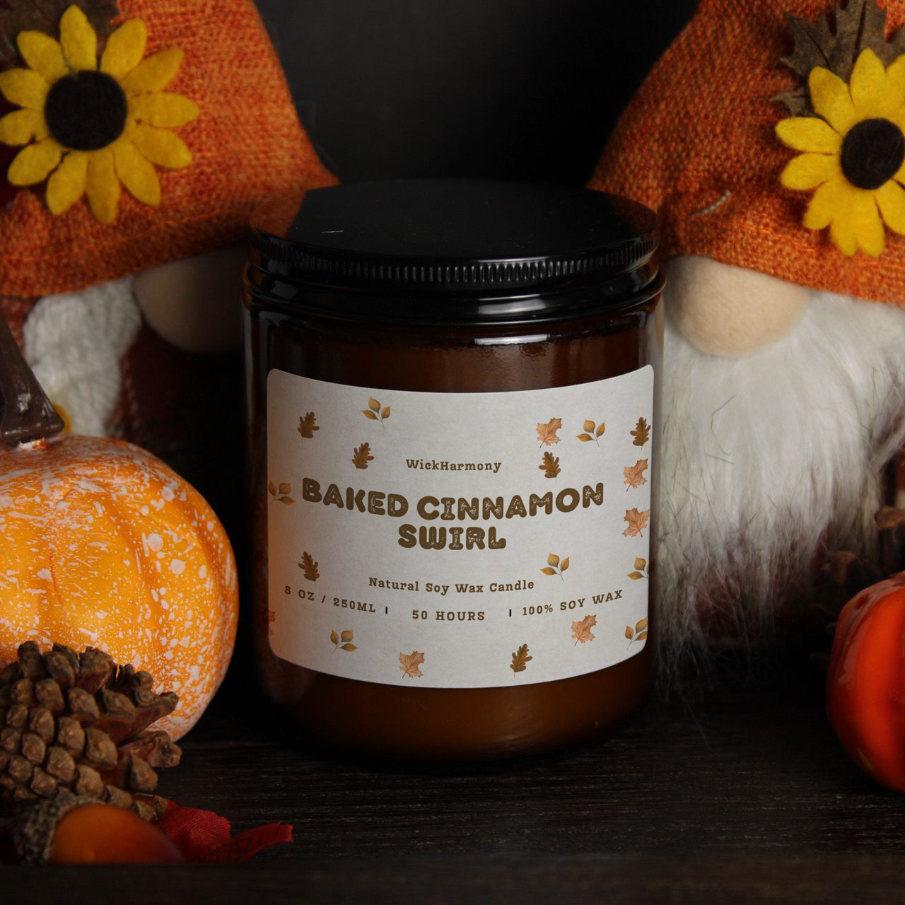 'The Autumn Breeze' soy candle by WickHarmony, styled in a festive scene with autumn gnomes and mini pumpkins