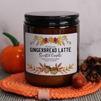 'The Watercolour Harvest' soy candle from WickHarmony, shown with the gingerbread latte design featuring an acorn illustration