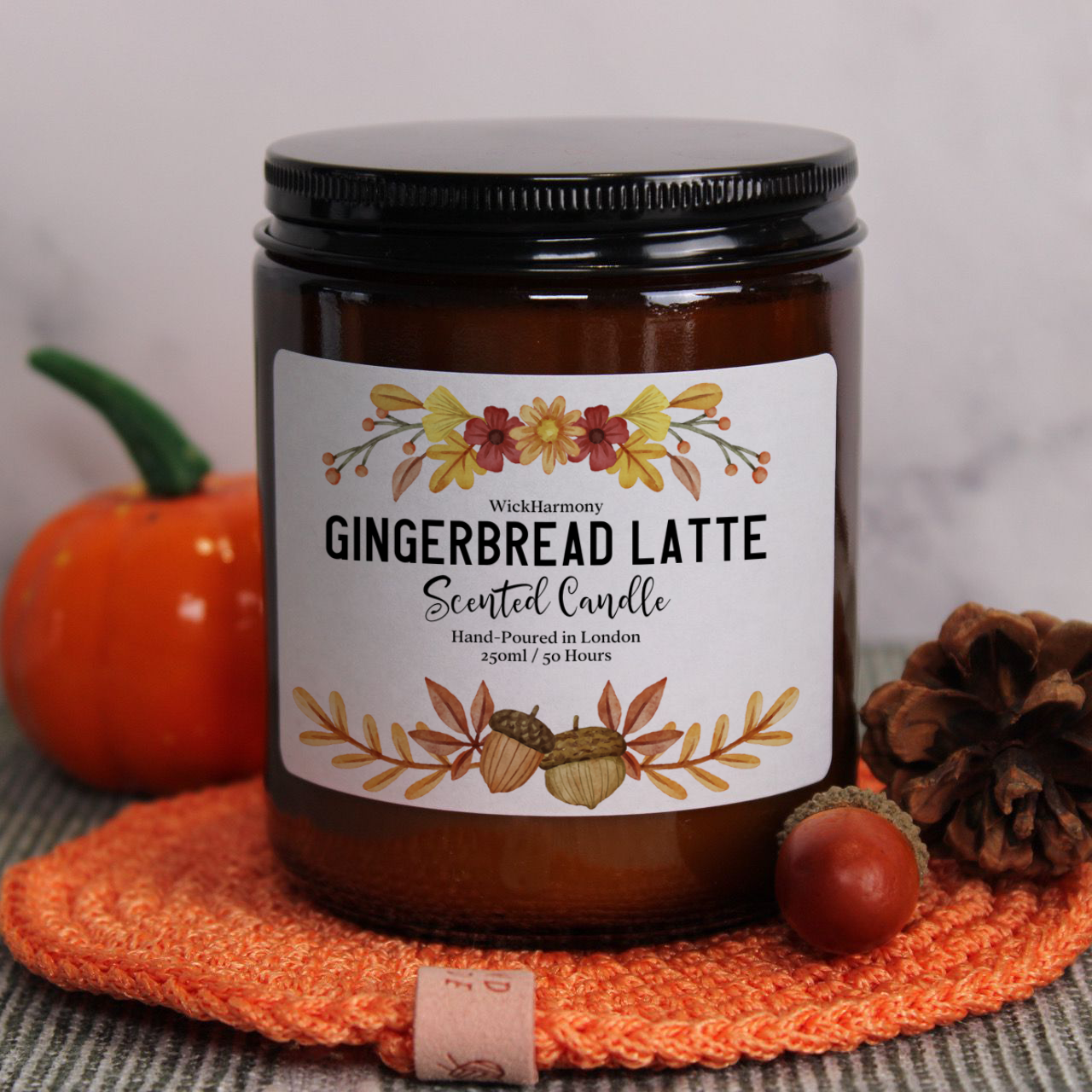 'The Watercolour Harvest' soy candle from WickHarmony, shown with the gingerbread latte design featuring an acorn illustration